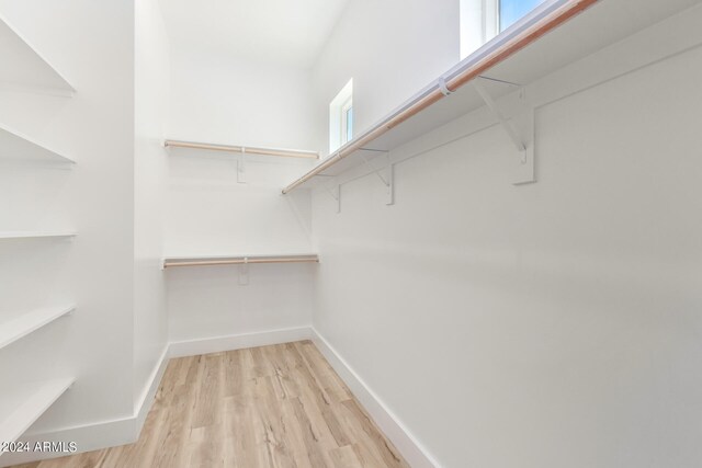 walk in closet featuring light wood-type flooring