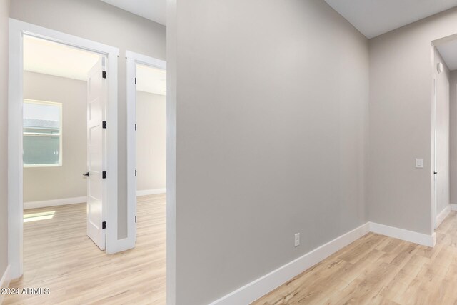 hallway featuring light hardwood / wood-style flooring