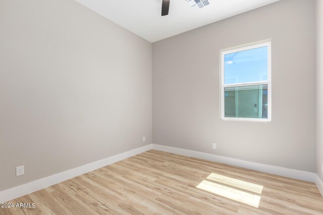 unfurnished room with light hardwood / wood-style flooring and ceiling fan