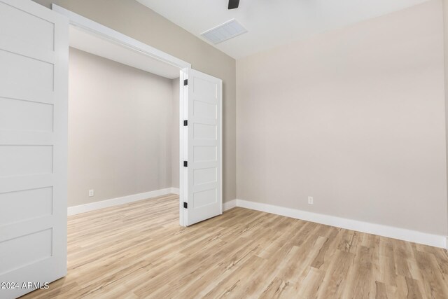 unfurnished room featuring light hardwood / wood-style floors