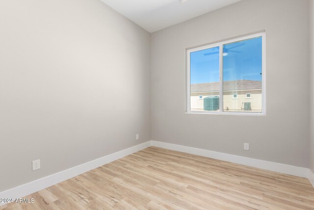 spare room featuring light wood-type flooring