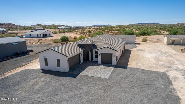 view of front of home featuring a mountain view and a garage