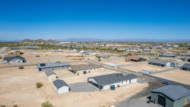 birds eye view of property with a mountain view