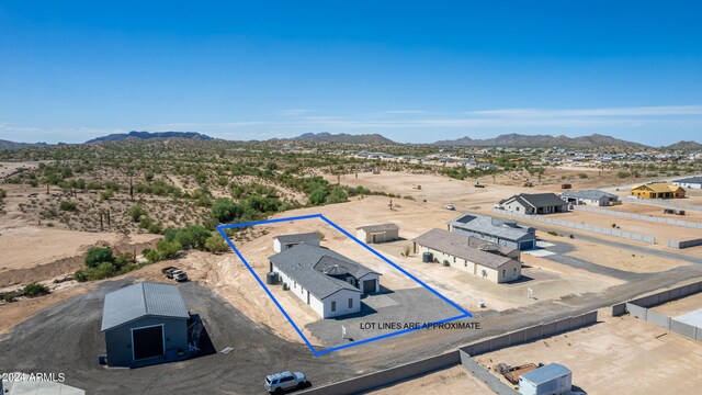 birds eye view of property featuring a mountain view