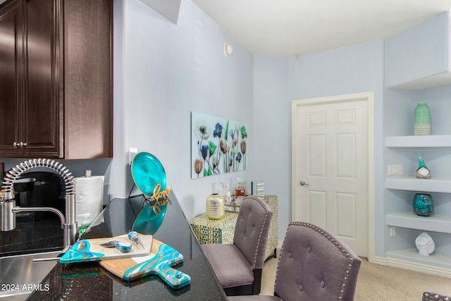 carpeted office featuring sink and built in features