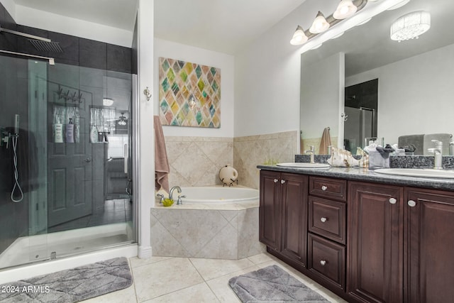 bathroom featuring tile patterned floors, shower with separate bathtub, and vanity