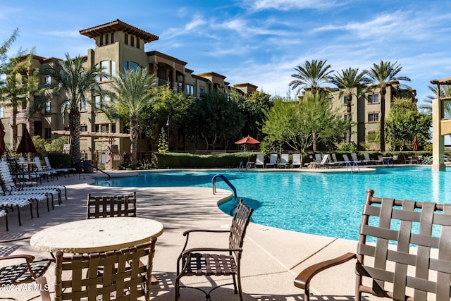 view of swimming pool featuring a patio