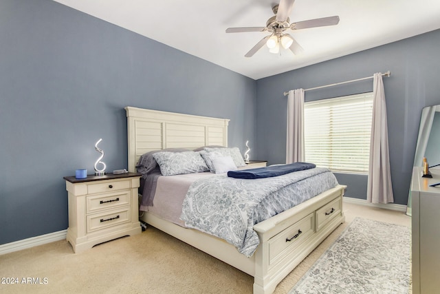 bedroom featuring ceiling fan and light colored carpet