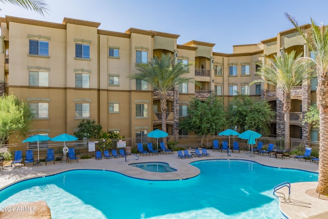 view of pool featuring a community hot tub