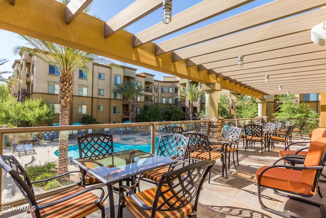 balcony featuring a pergola