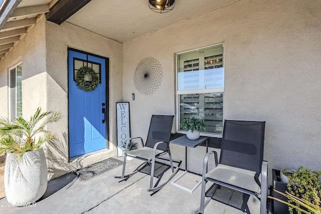 view of exterior entry with stucco siding