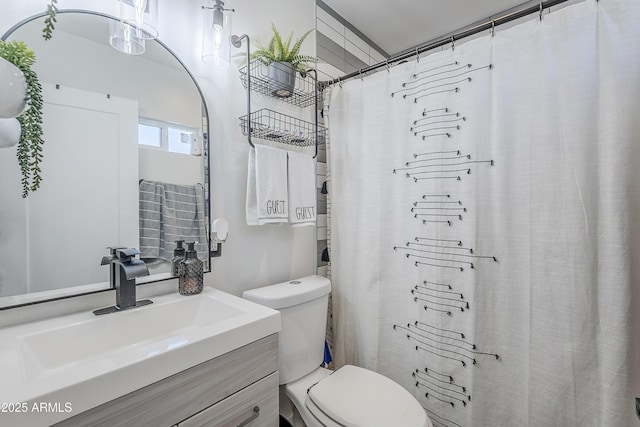 full bathroom with vanity and toilet