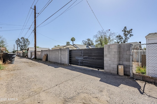 view of gate featuring fence