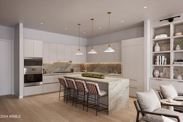 19360 N 73rd St Unit 1066, Scottsdale, AZ 85255 - kitchen featuring a center island, tasteful backsplash, light wood-type flooring, and white cabinets