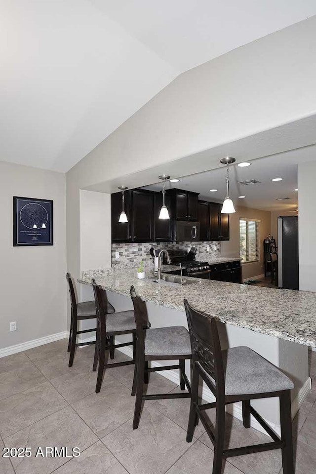2005 E Anderson Dr E, Phoenix, AZ 85022 - dining area featuring vaulted ceiling and baseboards