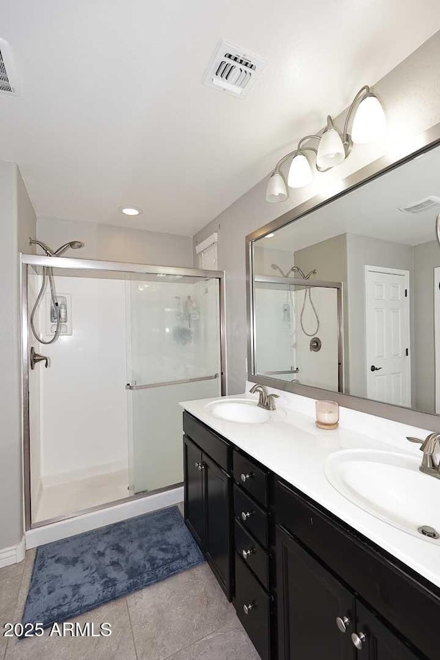 2005 E Anderson Dr E, Phoenix, AZ 85022 - full bathroom with a shower stall, tile patterned floors, and double vanity