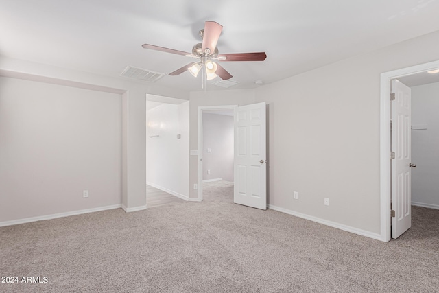 unfurnished bedroom with ceiling fan and light carpet