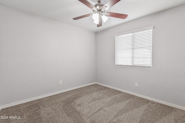 empty room with ceiling fan and carpet flooring