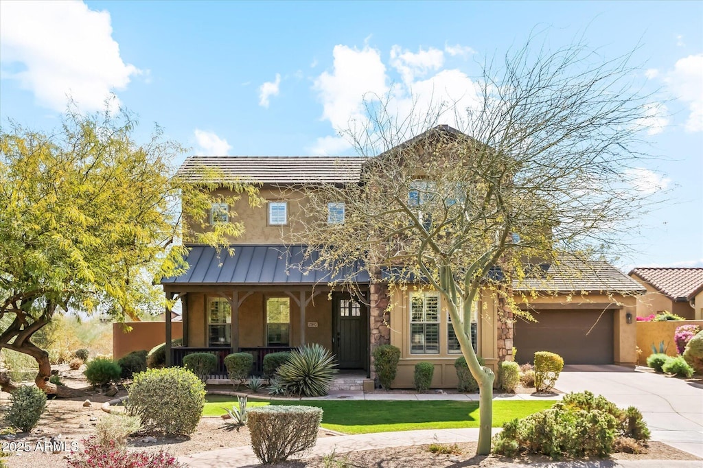17893 N 93rd St, Scottsdale, AZ 85255 - view of front of home featuring stucco siding, a porch, a standing seam roof, metal roof, and driveway