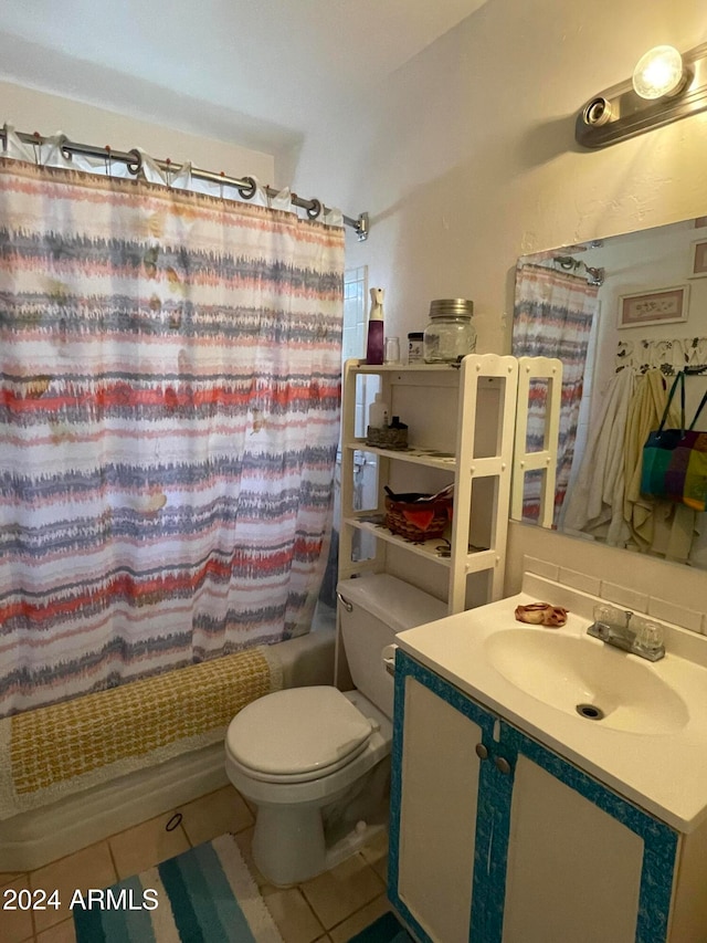 full bathroom with vanity, shower / tub combo with curtain, toilet, and tile patterned floors