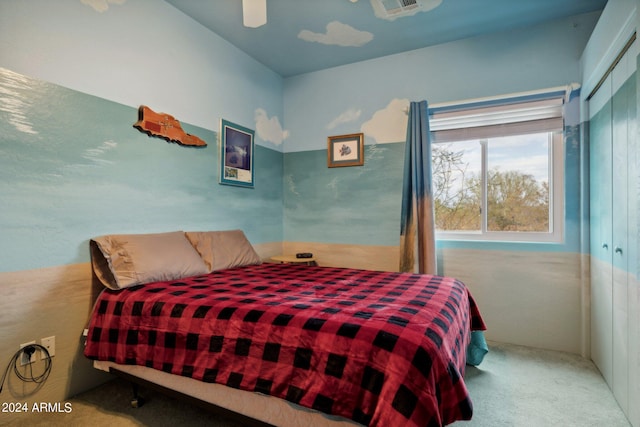 bedroom featuring ceiling fan, carpet floors, a closet, and visible vents