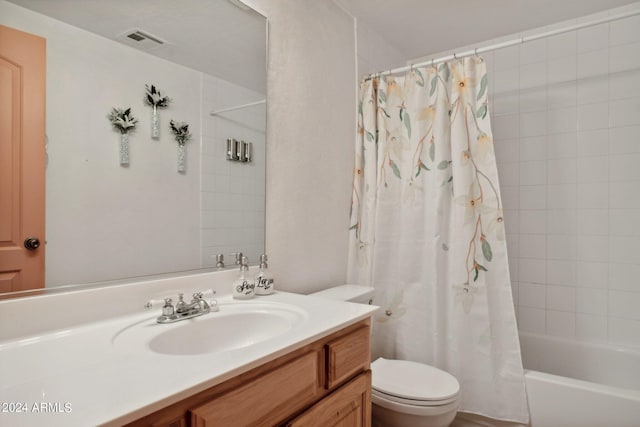 full bathroom with shower / bath combination with curtain, visible vents, vanity, and toilet