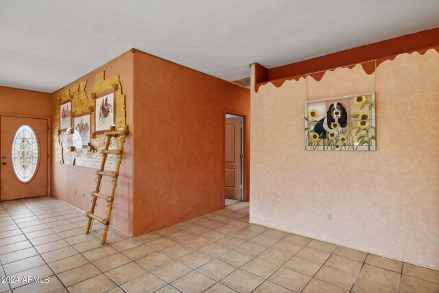 entrance foyer featuring light tile patterned floors