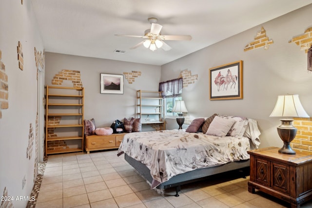 tiled bedroom featuring ceiling fan