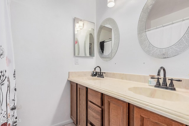 full bath with double vanity and a sink
