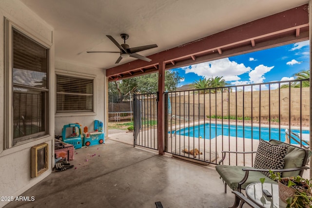 view of patio featuring a fenced backyard, ceiling fan, a trampoline, and a fenced in pool