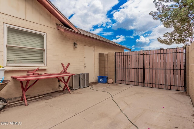 view of patio / terrace featuring fence and a gate