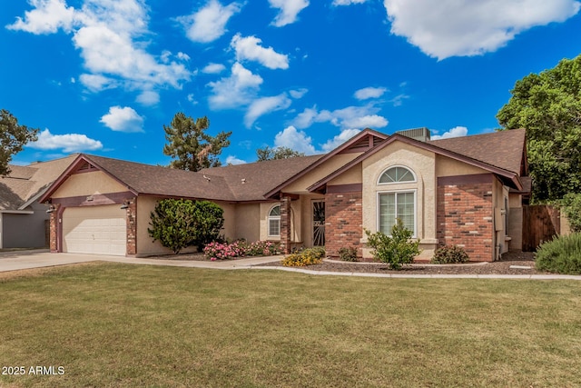 ranch-style house with an attached garage, brick siding, concrete driveway, stucco siding, and a front yard
