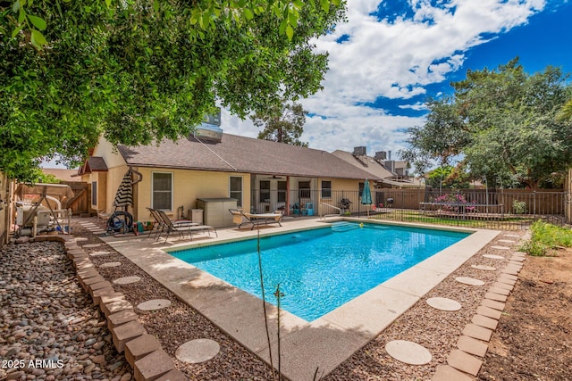 view of pool with a patio, a fenced backyard, and a fenced in pool