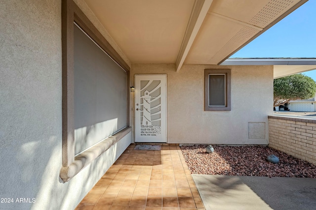 entrance to property featuring a patio area