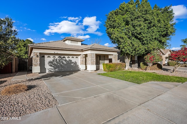 view of front of home with a front lawn and a garage