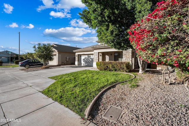 view of front facade with a front yard and a garage