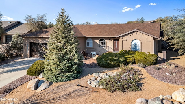 ranch-style house featuring a garage