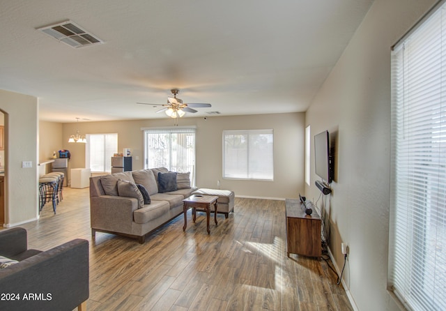 274 S 18th St, Coolidge, AZ 85128 - living room with wood-type flooring and ceiling fan with notable chandelier