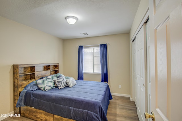 274 S 18th St, Coolidge, AZ 85128 - bedroom with a closet, wood-type flooring, and a textured ceiling