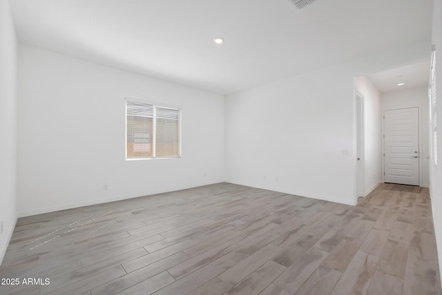 unfurnished room featuring light wood-type flooring