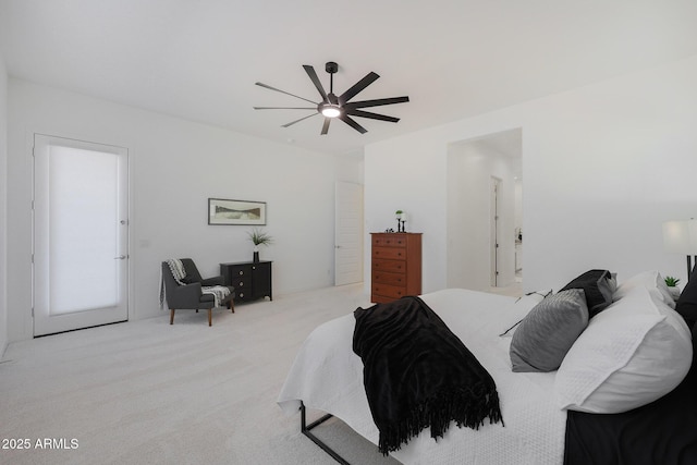 bedroom featuring ceiling fan and light carpet