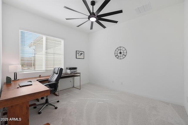 office space with ceiling fan and light colored carpet