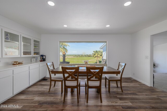 dining room with dark wood-type flooring