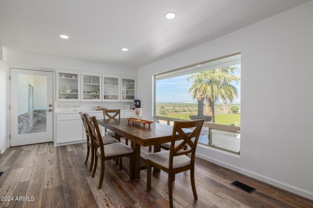 dining space featuring dark wood-type flooring