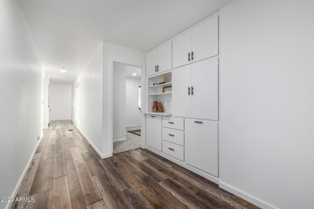 hall with dark hardwood / wood-style floors