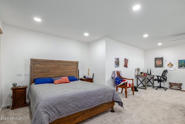 bedroom featuring light colored carpet