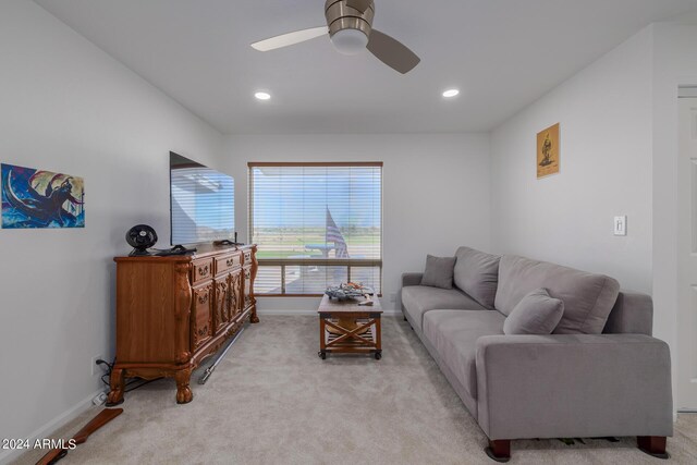 living room featuring ceiling fan and light carpet