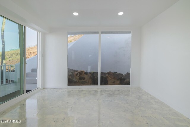 spare room with concrete floors