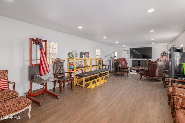 sitting room with hardwood / wood-style floors