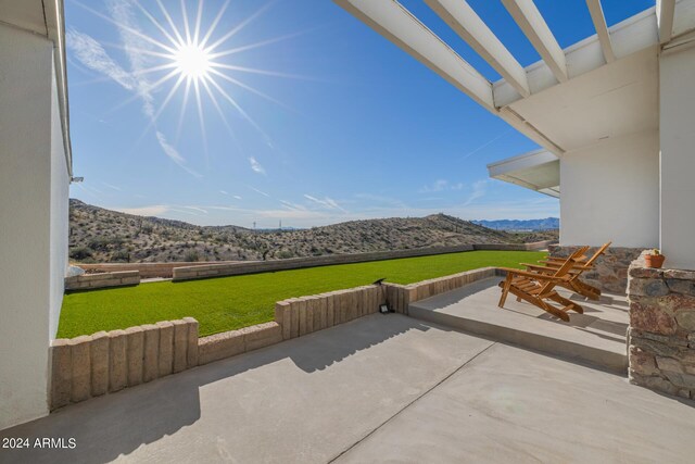 view of patio / terrace with a mountain view